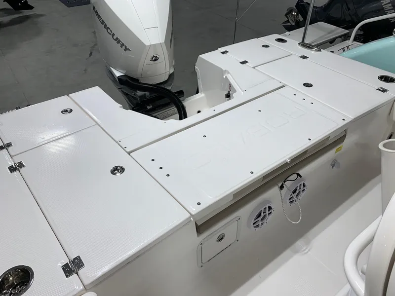 Slide: The Image of 2024 Robalo 246 Cayman boat deck with Mercury outboard motor. - 11
