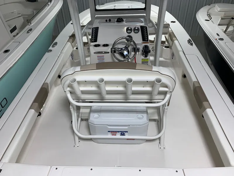 Slide: The Image of 2024 Robalo 246 Cayman boat interior with helm and seating. - 5