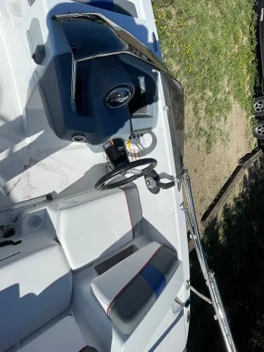 Slide: The Image of 2022 Tahoe T18 boat interior with steering wheel and seating. - 10