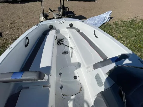 Slide: The Image of 2022 Tahoe T18 boat interior with seating and storage compartments. - 11