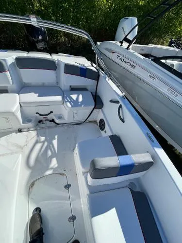 Slide: The Image of 2022 Tahoe T18 boat interior with seating and storage compartments. - 12