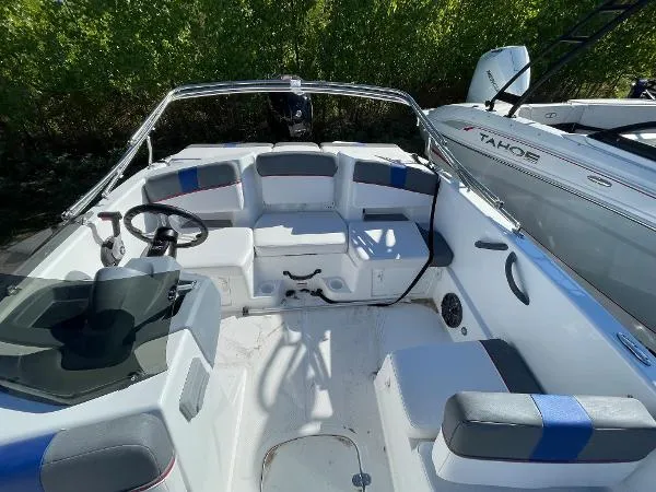Slide: The Image of 2022 Tahoe T18 boat interior with seating and steering wheel. - 5