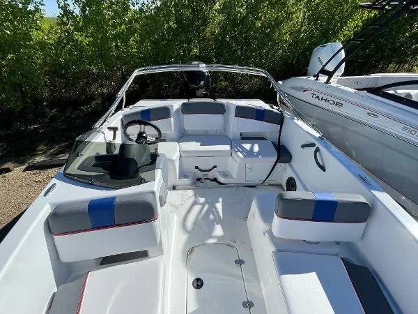 Slide: The Image of 2022 Tahoe T18 boat interior with seating and steering wheel. - 8
