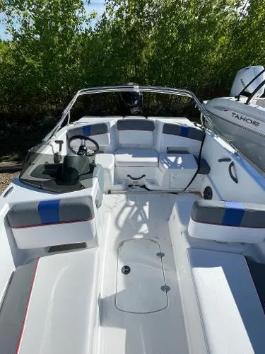 Slide: The Image of 2022 Tahoe T18 boat interior with seating and steering wheel. - 9