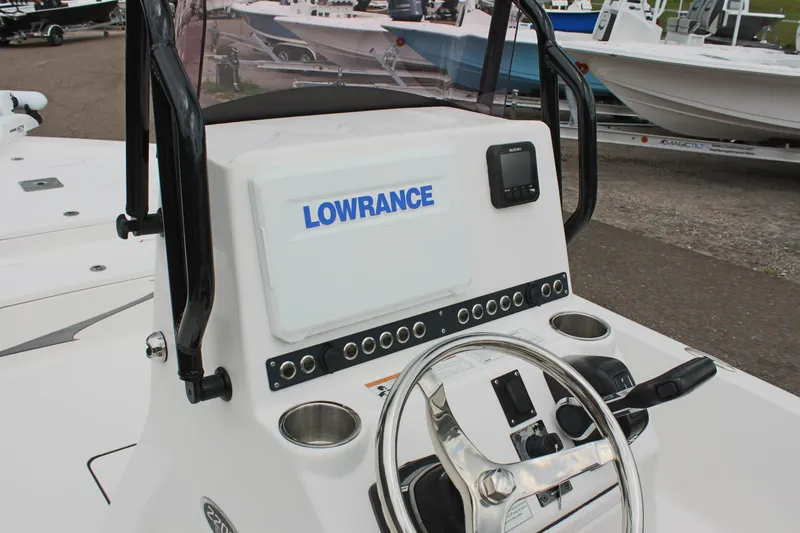 Slide: The Image of 2022 Blue Wave 2200 STL boat console with Lowrance electronics and steering wheel. - 12