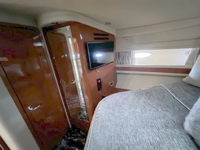 Slide: The Image of Interior cabin of 2000 Sea Ray 460 Sundancer with TV and bed. - 17