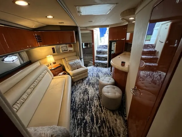 Slide: The Image of Luxurious interior of a 2000 Sea Ray 460 Sundancer yacht with plush seating and modern amenities. - 19