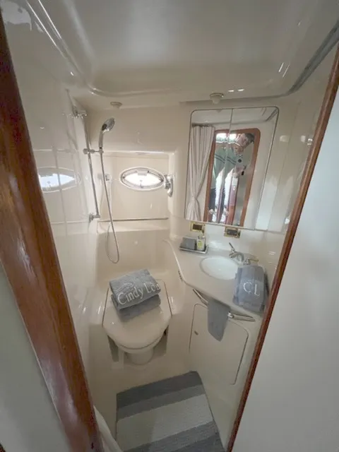 Slide: The Image of Bathroom interior of a 2000 Sea Ray 460 Sundancer yacht with shower and sink. - 21