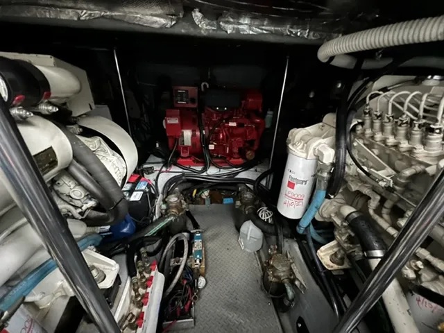 Slide: The Image of Engine room of a 2000 Sea Ray 460 Sundancer yacht, showcasing mechanical components. - 26