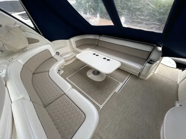 Slide: The Image of Interior seating area of a 2000 Sea Ray 460 Sundancer yacht with beige upholstery. - 5