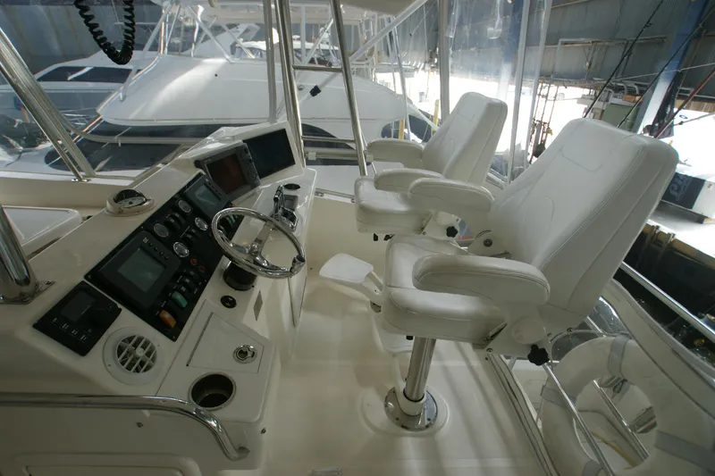 Slide: The Image of Riviera 48 Convertible 2000 helm with two white seats. - 12