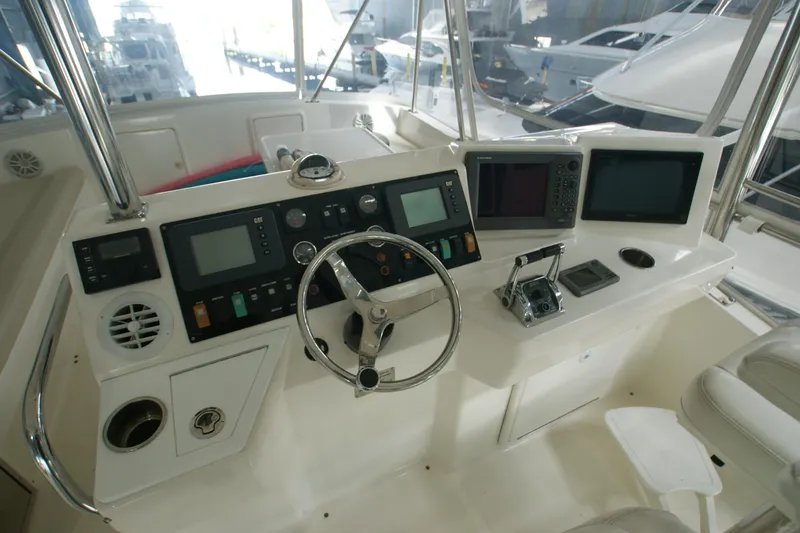 Slide: The Image of Cockpit of 2000 Riviera 48 Convertible with controls and navigation systems. - 13