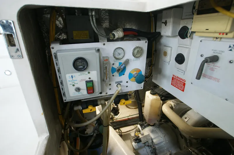 Slide: The Image of Engine room of 2000 Riviera 48 Convertible with control panel. - 15