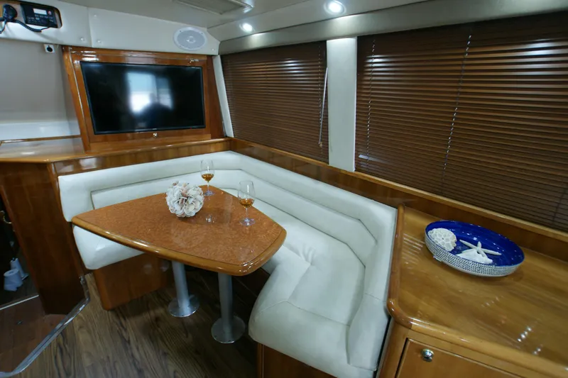 Slide: The Image of Interior of 2000 Riviera 48 Convertible yacht with elegant seating area. - 6