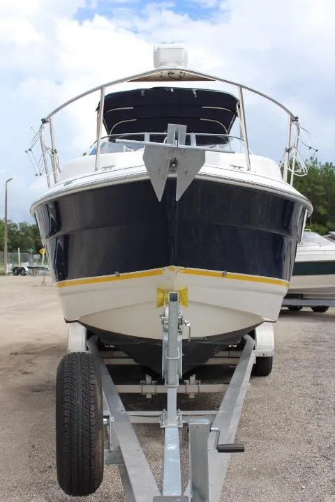Slide: The Image of 2005 Larson Cabrio 240 boat on a trailer, front view. - 5
