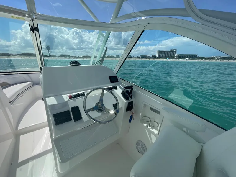 Slide: The Image of Aerial view of 2022 Albemarle 27 DC boat cruising on open water. - 11