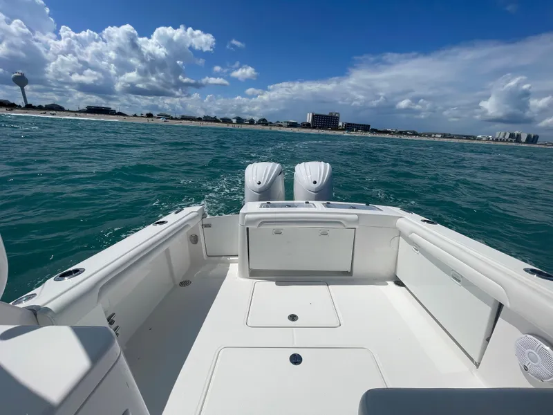 Slide: The Image of 2022 Albemarle 27 DC boat interior with ocean view through clear canopy. - 16