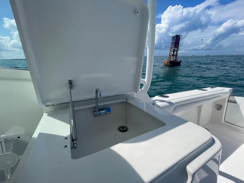 Slide: The Image of Control panel of 2022 Albemarle 27 DC boat with radio and phone holder. - 19