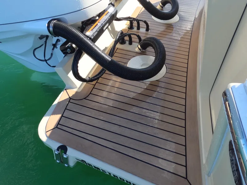 Slide: The Image of 2022 Albemarle 27 DC boat with Yamaha outboard engine on clear water. - 23