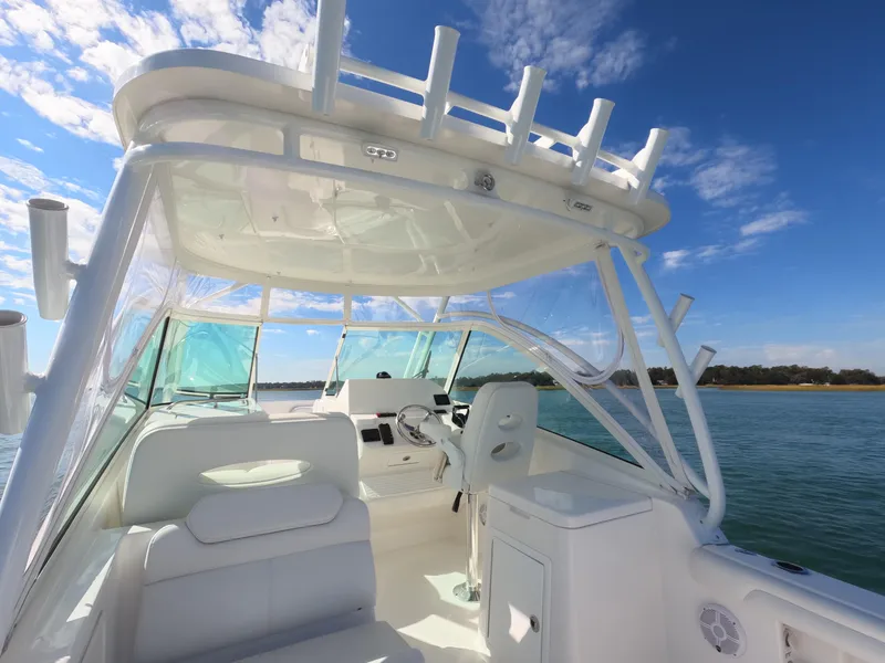 Slide: The Image of 2022 Albemarle 27 DC boat on calm green water. - 25