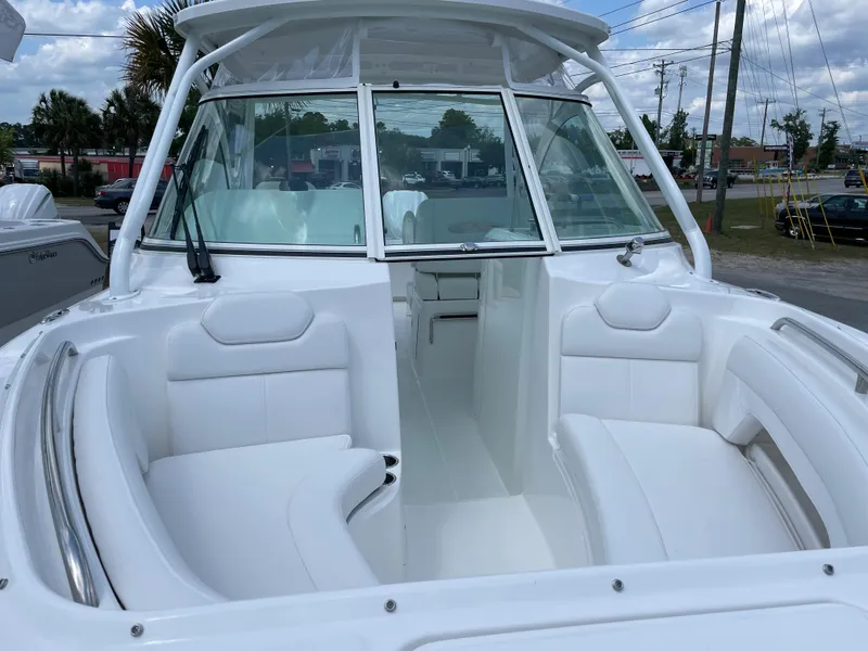Slide: The Image of 2022 Albemarle 27 DC boat dashboard with steering wheel and navigation controls. - 35