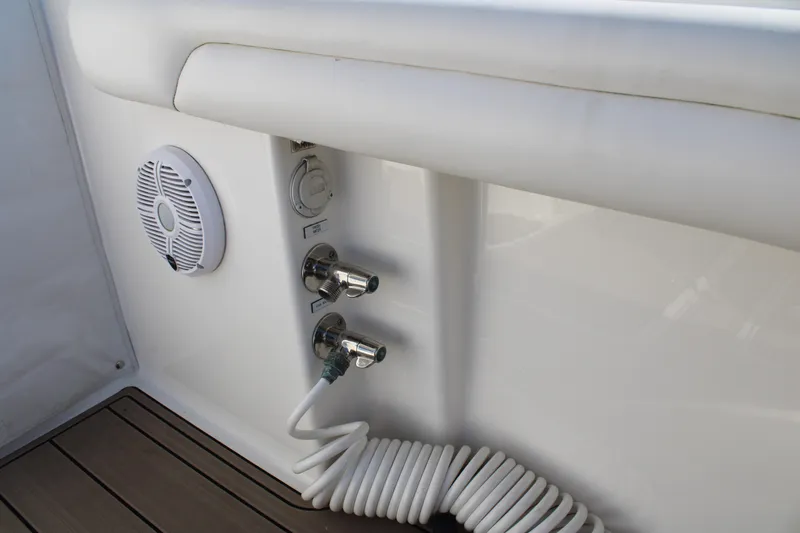 Slide: The Image of 2022 Albemarle 27 DC boat deck with speaker and hose connections. - 41