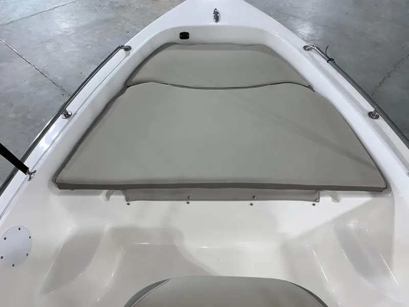 Slide: The Image of 2024 Key West 1720 Sportsman boat bow seating area with gray cushions. - 14