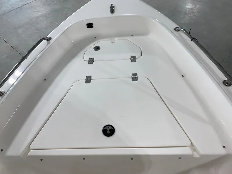 Slide: The Image of 2024 Key West 1720 Sportsman boat bow storage compartments. - 13