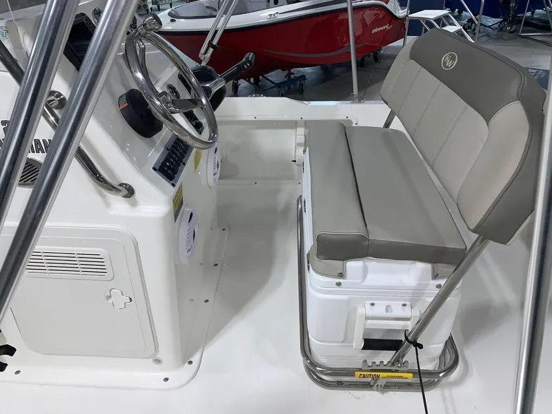 Slide: The Image of 2024 Key West 1720 Sportsman boat interior with steering console and cushioned seating. - 15