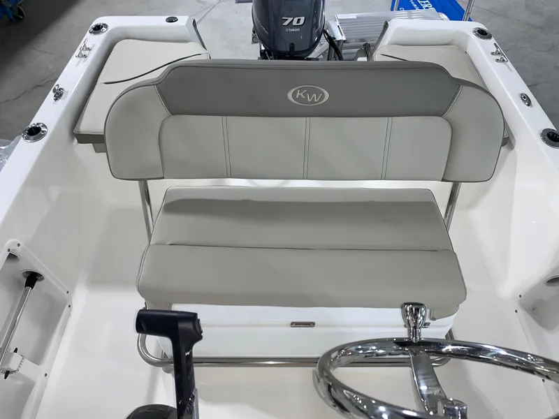 Slide: The Image of 2024 Key West 1720 Sportsman boat interior with seating and steering wheel. - 7