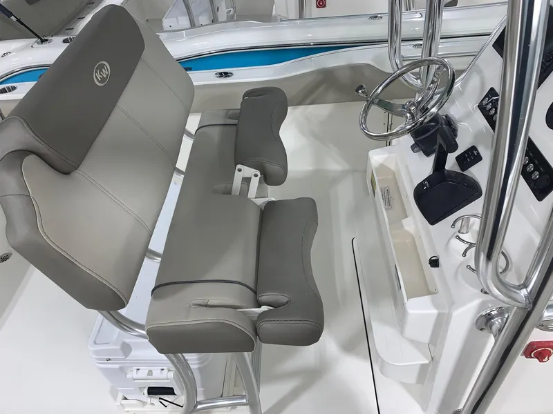 Slide: The Image of 2024 Key West 239 FS boat interior with helm and seating. - 11