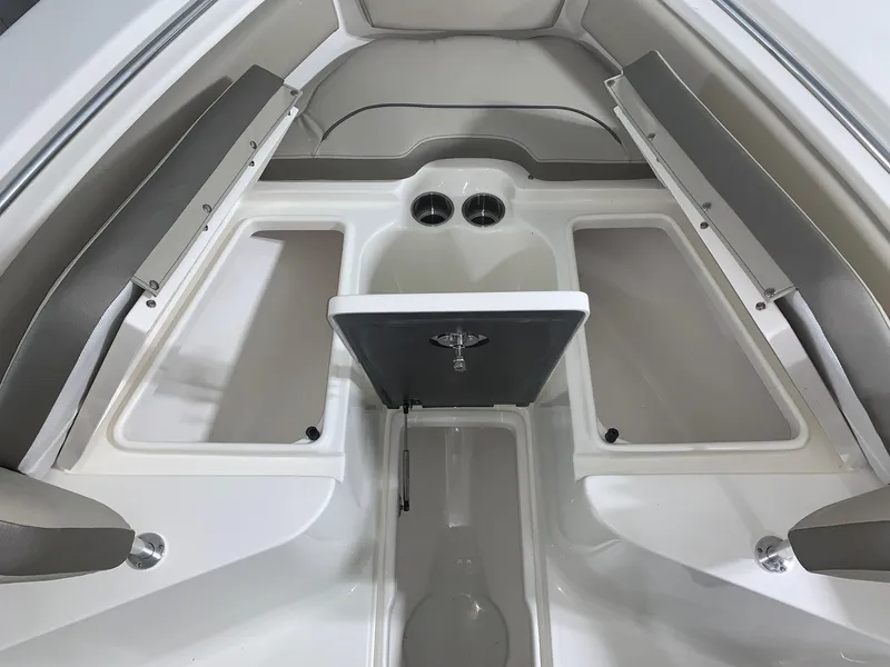 Slide: The Image of 2024 Key West 239 FS boat interior with seating and storage compartments. - 14