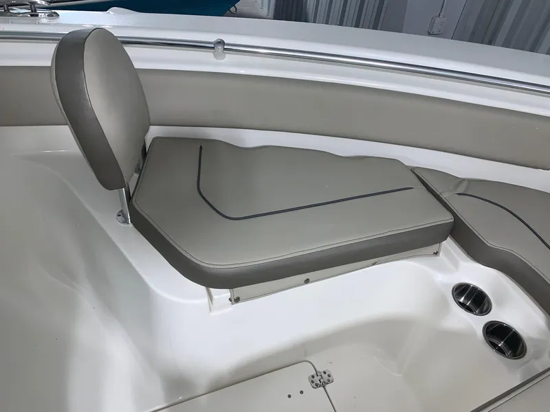 Slide: The Image of 2024 Key West 239 FS boat interior seating with cup holders. - 15
