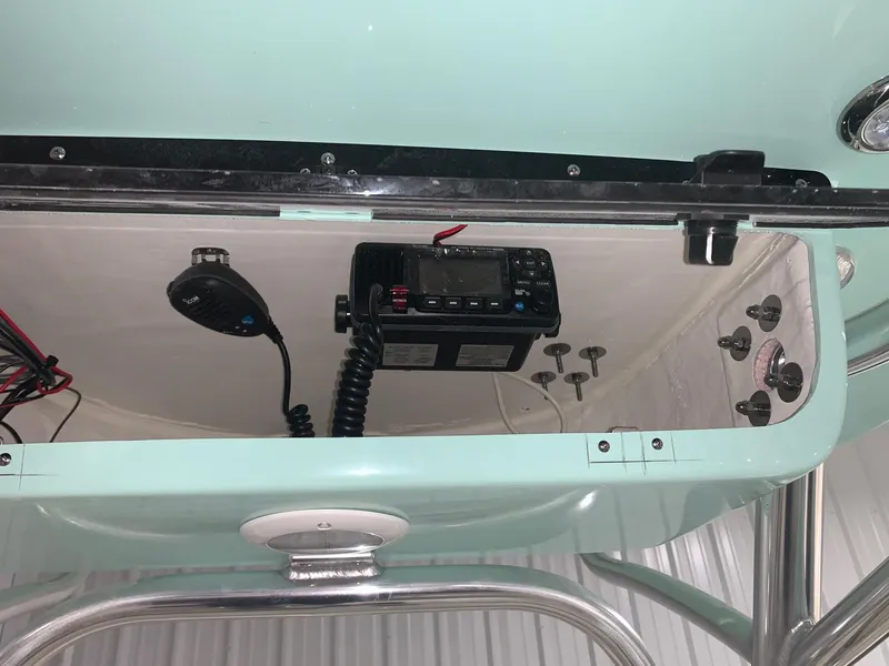 Slide: The Image of 2024 Key West 239 FS boat console with radio and controls. - 5