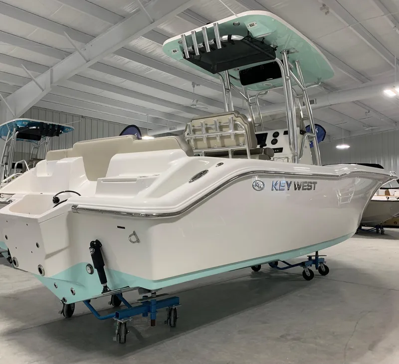 Slide: The Image of 2024 Key West 239 FS boat in showroom, rear view. - 1