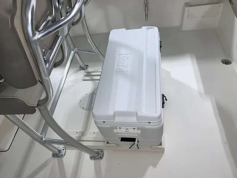 Slide: The Image of 2024 Key West 239 FS boat interior with cooler and seating. - 6