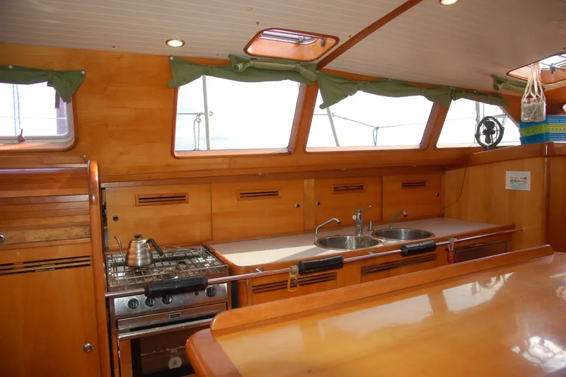 Slide: The Image of Interior of 2000 Garcia 48 Raised Salon yacht with wooden kitchen and dual sinks. - 55