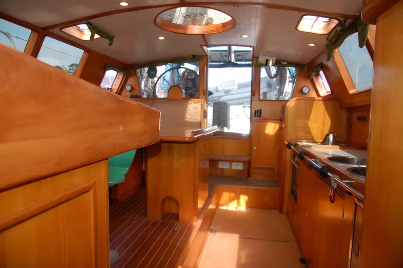 Slide: The Image of Interior of 2000 Garcia 48 Raised Salon yacht with wooden finishes and modern amenities. - 76