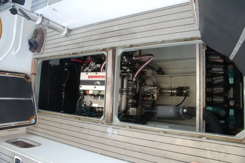 Slide: The Image of Engine compartment of a 2000 Garcia 48 Raised Salon yacht, showcasing mechanical components. - 36
