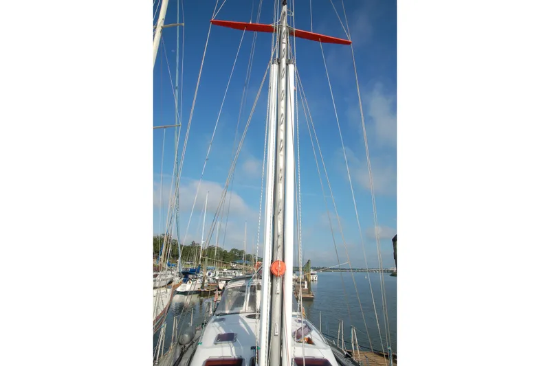 Slide: The Image of Sailboat Garcia 48 Raised Salon 2000 docked at marina, mast view under clear sky. - 26