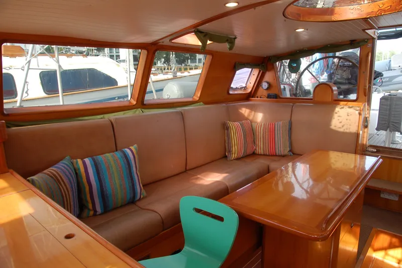 Slide: The Image of Cozy interior of 2000 Garcia 48 Raised Salon yacht with colorful cushions and wooden furnishings. - 59