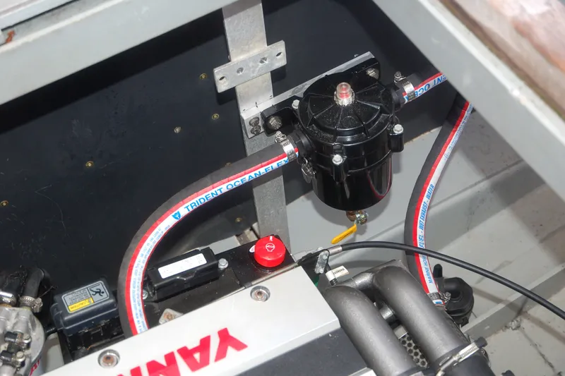 Slide: The Image of Engine compartment of 2000 Garcia 48 Raised Salon yacht, featuring Yanmar components and Trident Ocean hoses. - 39