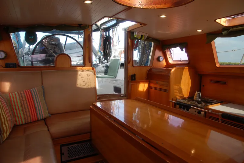 Slide: The Image of Luxurious interior of 2000 Garcia 48 Raised Salon yacht with wooden finishes and cozy seating. - 58