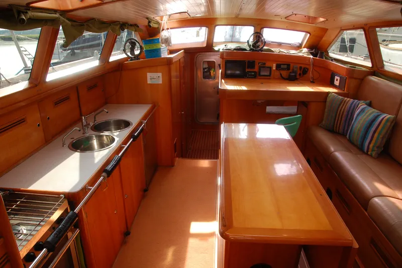 Slide: The Image of Interior of 2000 Garcia 48 Raised Salon yacht with kitchen and seating area. - 52