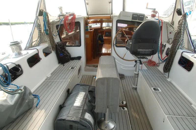 Slide: The Image of Interior view of a 2000 Garcia 48 Raised Salon yacht cockpit with steering wheel. - 30