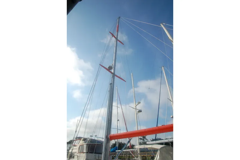 Slide: The Image of Sailboat mast of 2000 Garcia 48 Raised Salon against a clear blue sky. - 24