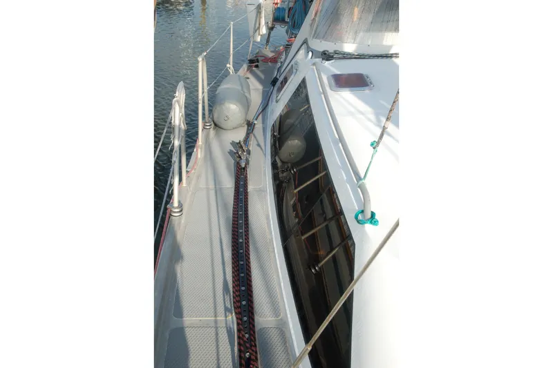Slide: The Image of Deck view of 2000 Garcia 48 Raised Salon yacht with ropes and fenders. - 18