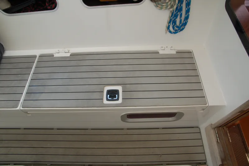 Slide: The Image of Deck of 2000 Garcia 48 Raised Salon yacht with storage compartment and rope. - 44