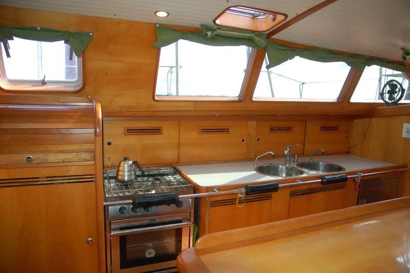 Slide: The Image of Interior of 2000 Garcia 48 Raised Salon yacht kitchen with stove and sink. - 56
