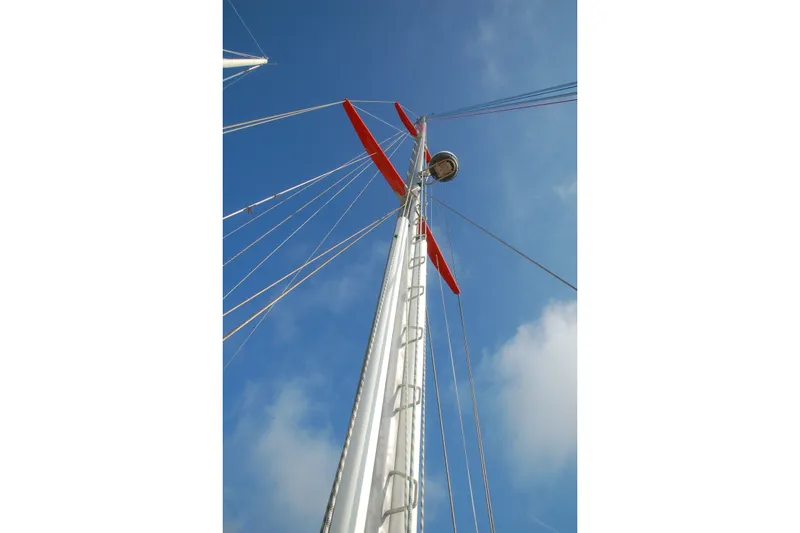 Slide: The Image of Tall mast of 2000 Garcia 48 Raised Salon sailboat against clear blue sky. - 27
